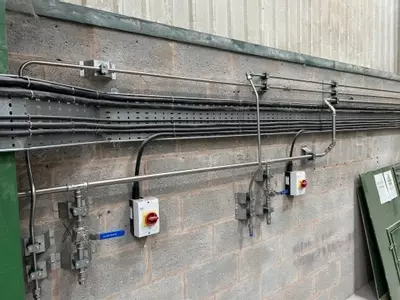 Completed wash bay installation showing the feeds and outlet points supplied by the new low and high-pressure pipework system. Designed to provide convenient access for operators while keeping the wash area organised and efficient for daily use.